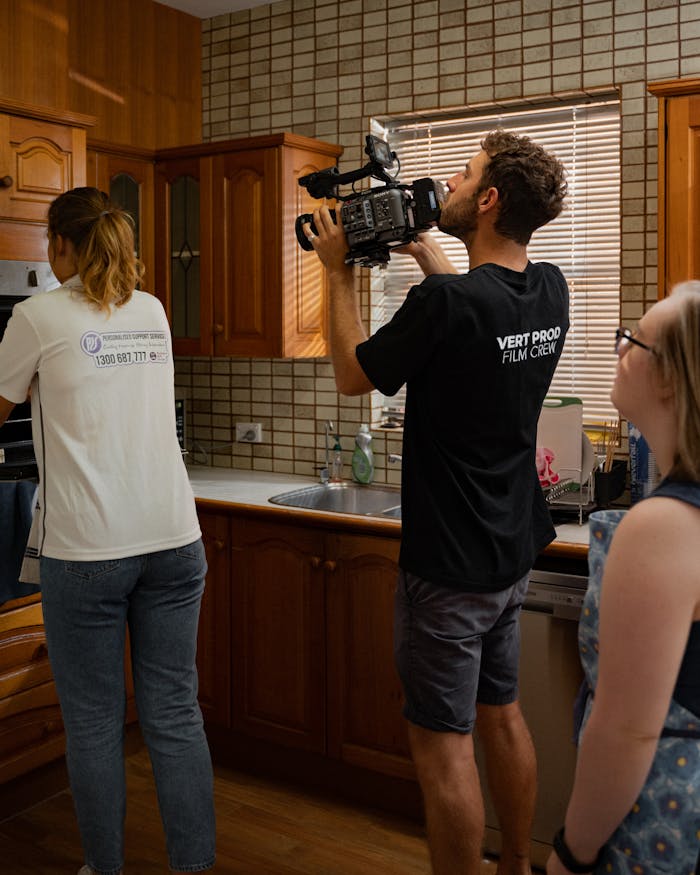 portfolio-04 Film crew captures cinematic moments in a Sydney kitchen setting. Discover the art of filmmaking indoors.